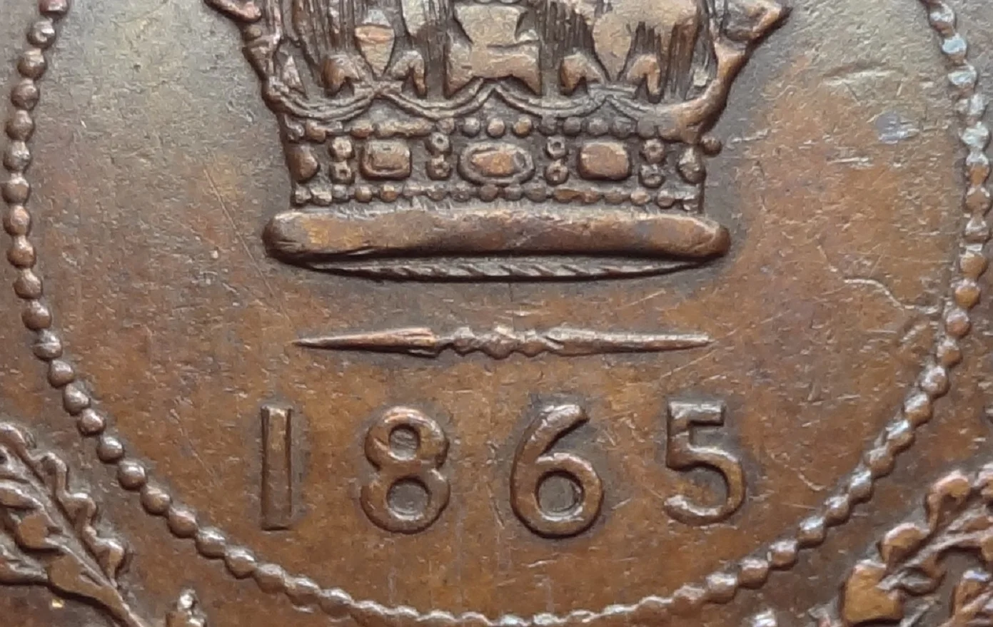 Close-up of an 1865 Newfoundland cent date showing a repunched 6