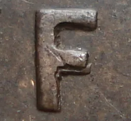 Re-engraved F in NEWF