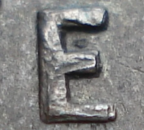Re-engraved E in NEWF