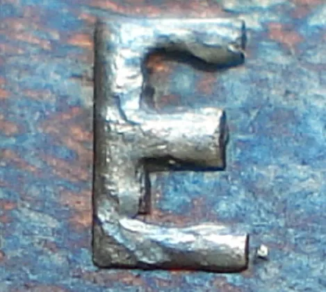 Re-engraved E in ONE