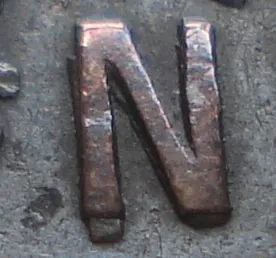 Re-engraved N in NEWF