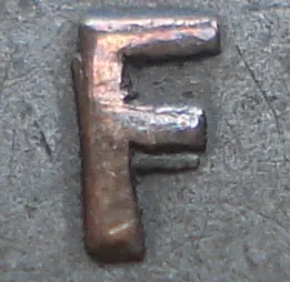 Re-engraved F in NEWF
