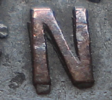 Re-engraved N in NEWF