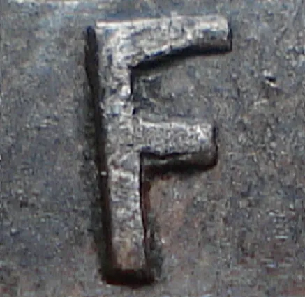 Re-engraved F in NEWF