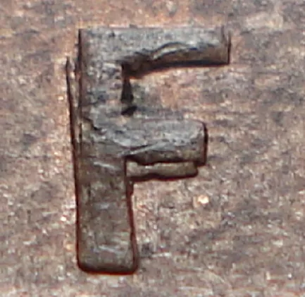 Re-engraved F in NEWF