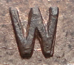 Re-engraved W in NEWF
