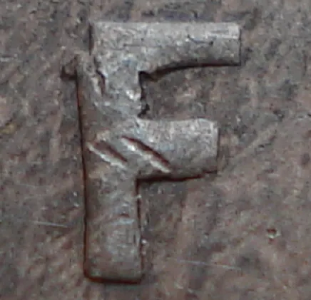 Re-engraved F in NEWF