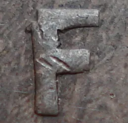 Re-engraved F in NEWF
