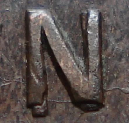 Re-engraved N in NEWF