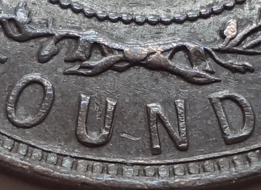 Re-engraved U in OUND z