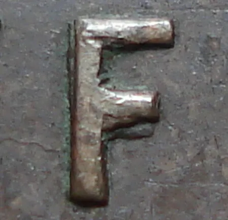 Re-engraved F in NEWF