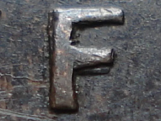 Re-engraved F in NEWF