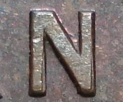 Re-engraved N in ('LAND)